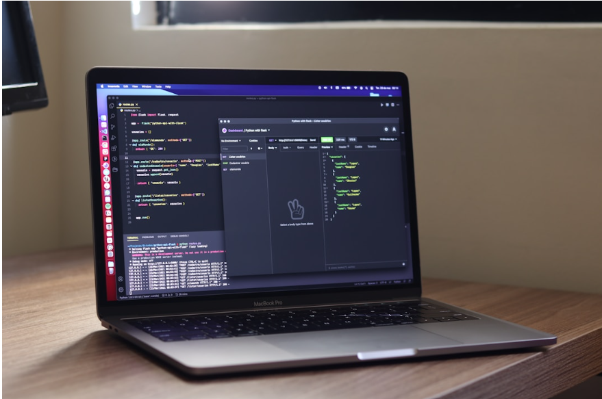  A laptop featuring a programming application focused on fax API service development.
